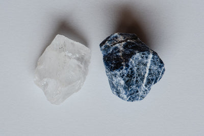 The white crystal next to the blue gem stone
