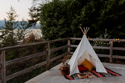 The small outdoor tepee on the terace with threes around, time to relax